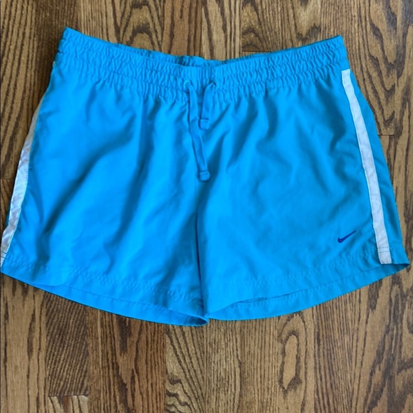 Bright turquoise with white side stripe Nike shorts with pockets, size women’s L - Picture 1 of 16